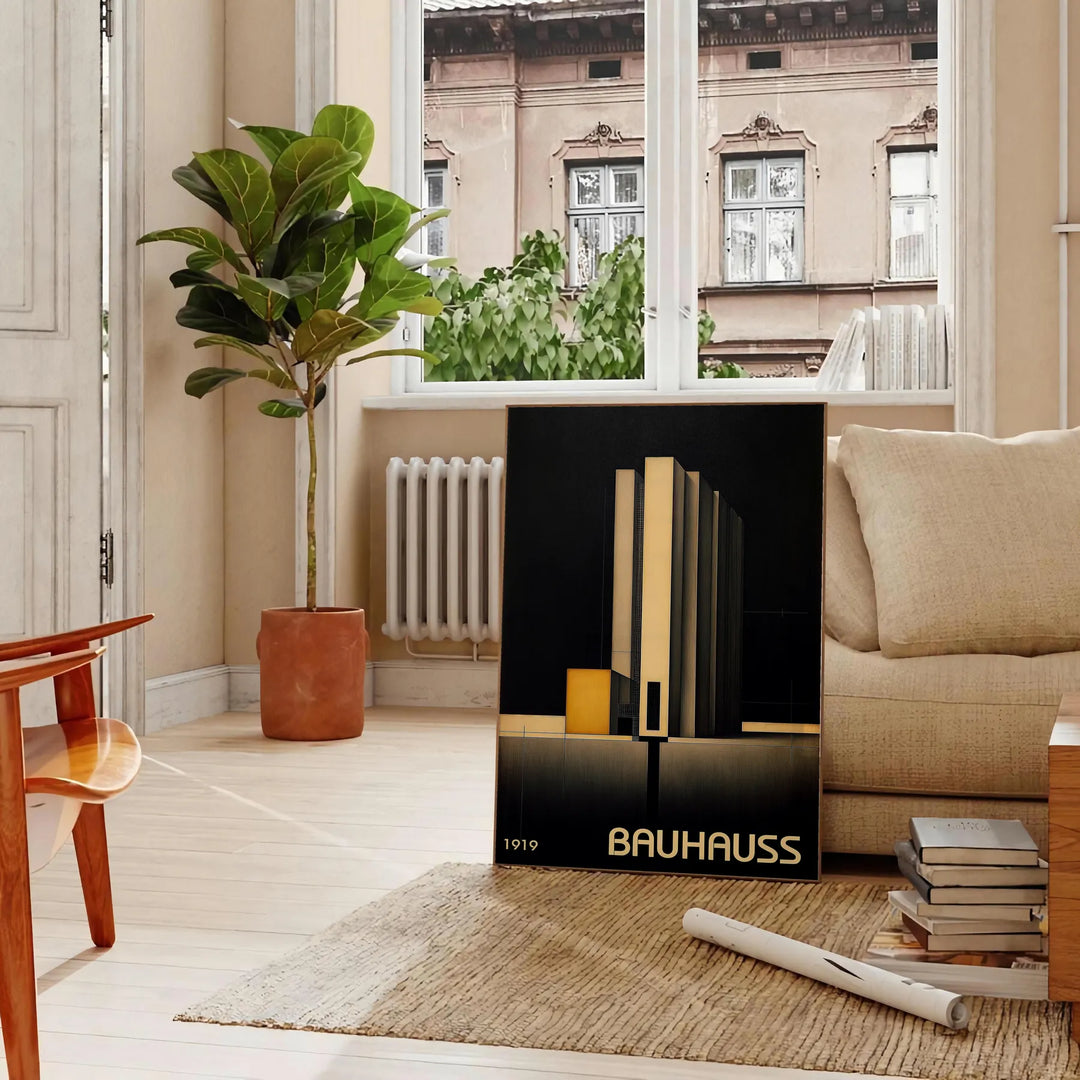 Dark Bauhaus geometric art poster in black and gray minimalist style - in a Parisian living room with a sofa and a fig plant