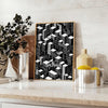 Black and gray Bauhaus poster with geometric modern abstract design - styled on a counter with eucalyptus and a bowl of lemons