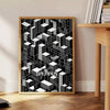 Black and gray Bauhaus poster with geometric modern abstract design - beside a round wooden side table with books