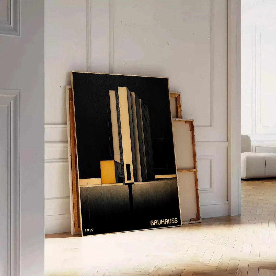 Dark Bauhaus poster with geometric shapes in black and muted tones - leaning on a herringbone floor against a white panelled wall