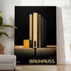Dark Bauhaus poster with geometric shapes in black and muted tones - in a bright minimalist room with a plant and an armchair