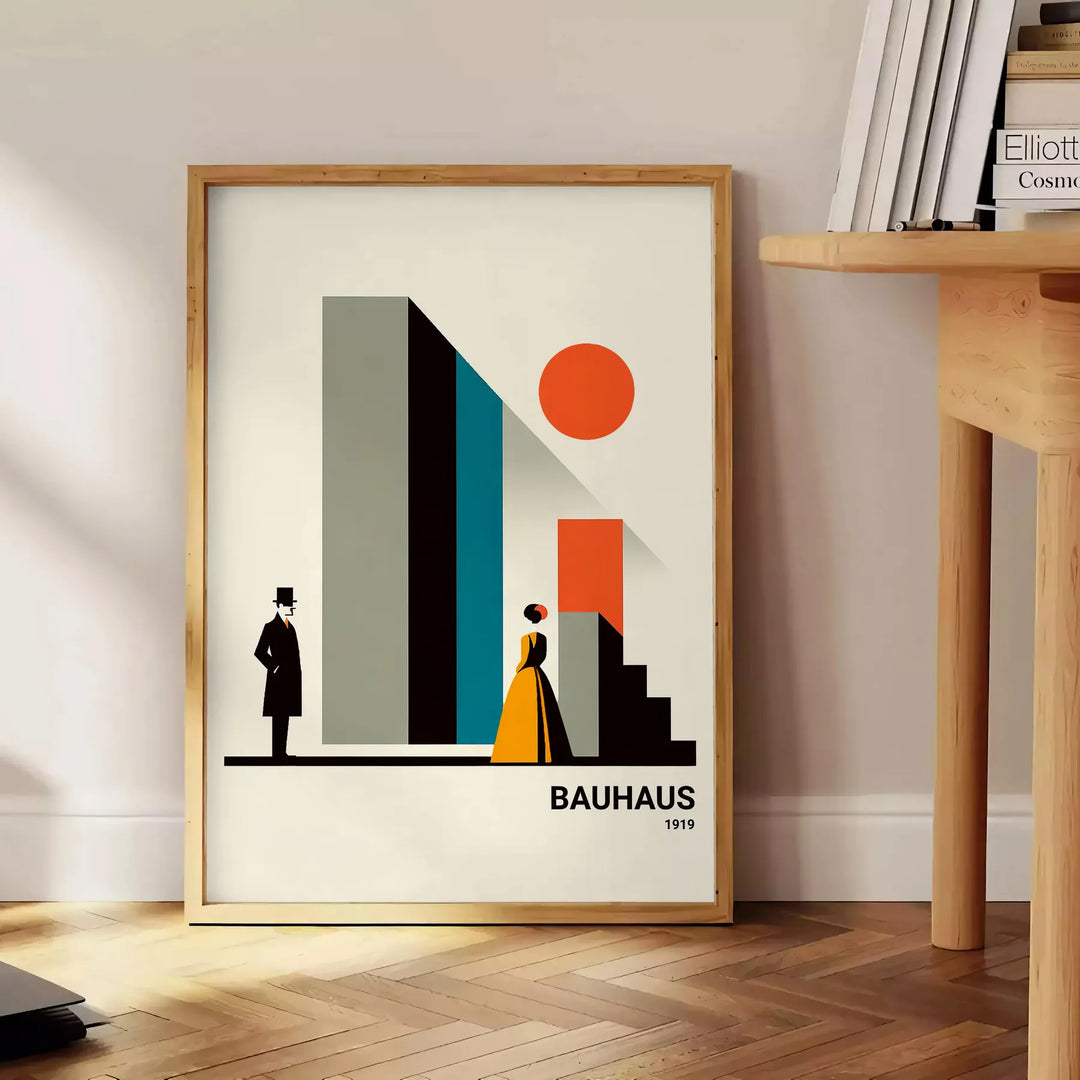 Bauhaus poster of stylized human figure in orange and white - beside a round wooden side table with books