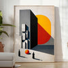 Bauhaus poster featuring a stylized human figure in orange and black - in a bright minimalist room with a plant and an armchair