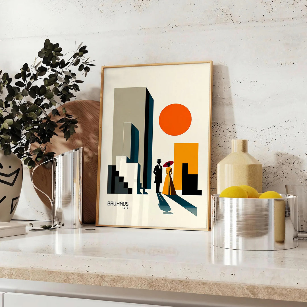 Poster showing a Bauhaus-style human figure in minimalist geometric composition - styled on a counter with eucalyptus and a bowl of lemons