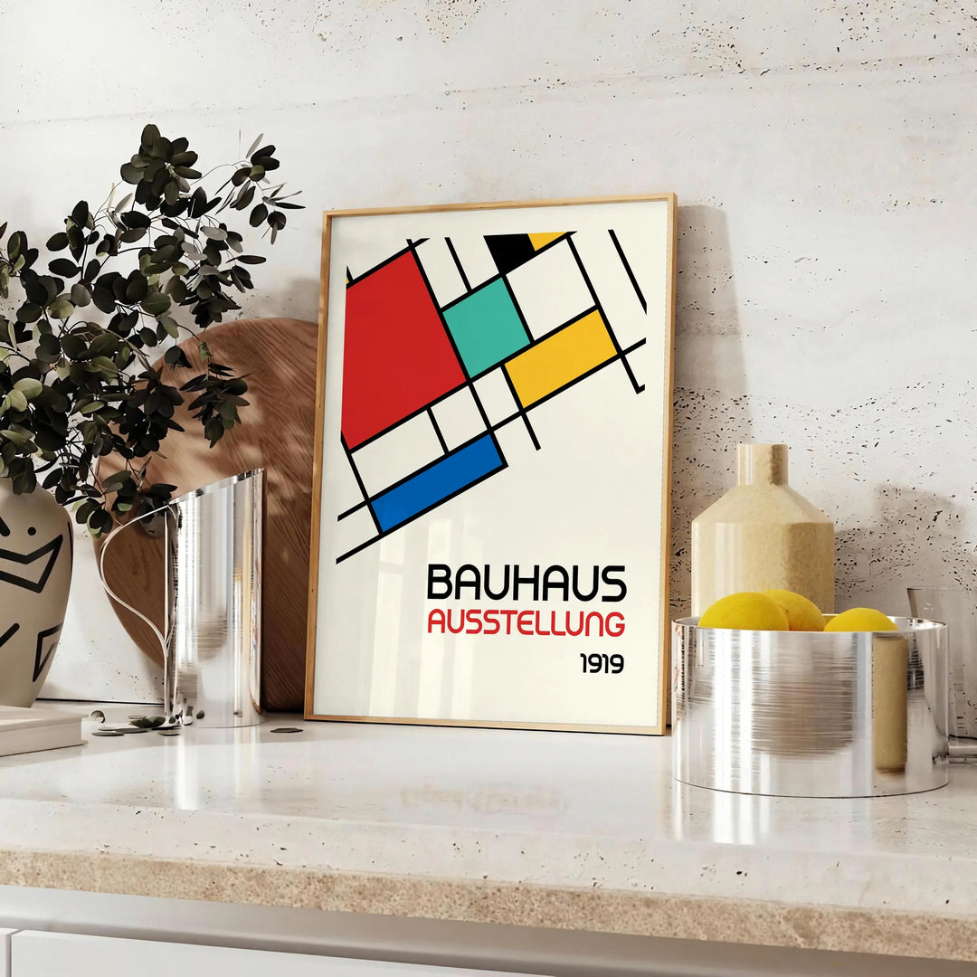 Bauhaus poster showing abstract geometric composition with modern minimalist design - styled on a counter with eucalyptus and a bowl of lemons