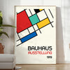 Bauhaus poster showing abstract geometric composition with modern minimalist design - in a bright minimalist room with a plant and an armchair