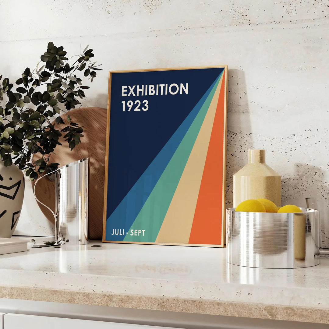 Minimalist Bauhaus poster featuring abstract geometric composition in neutral tones. - styled on a counter with eucalyptus and a bowl of lemons