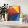 Bauhaus poster showing abstract geometric composition in minimalist modern style - styled on a counter with eucalyptus and a bowl of lemons
