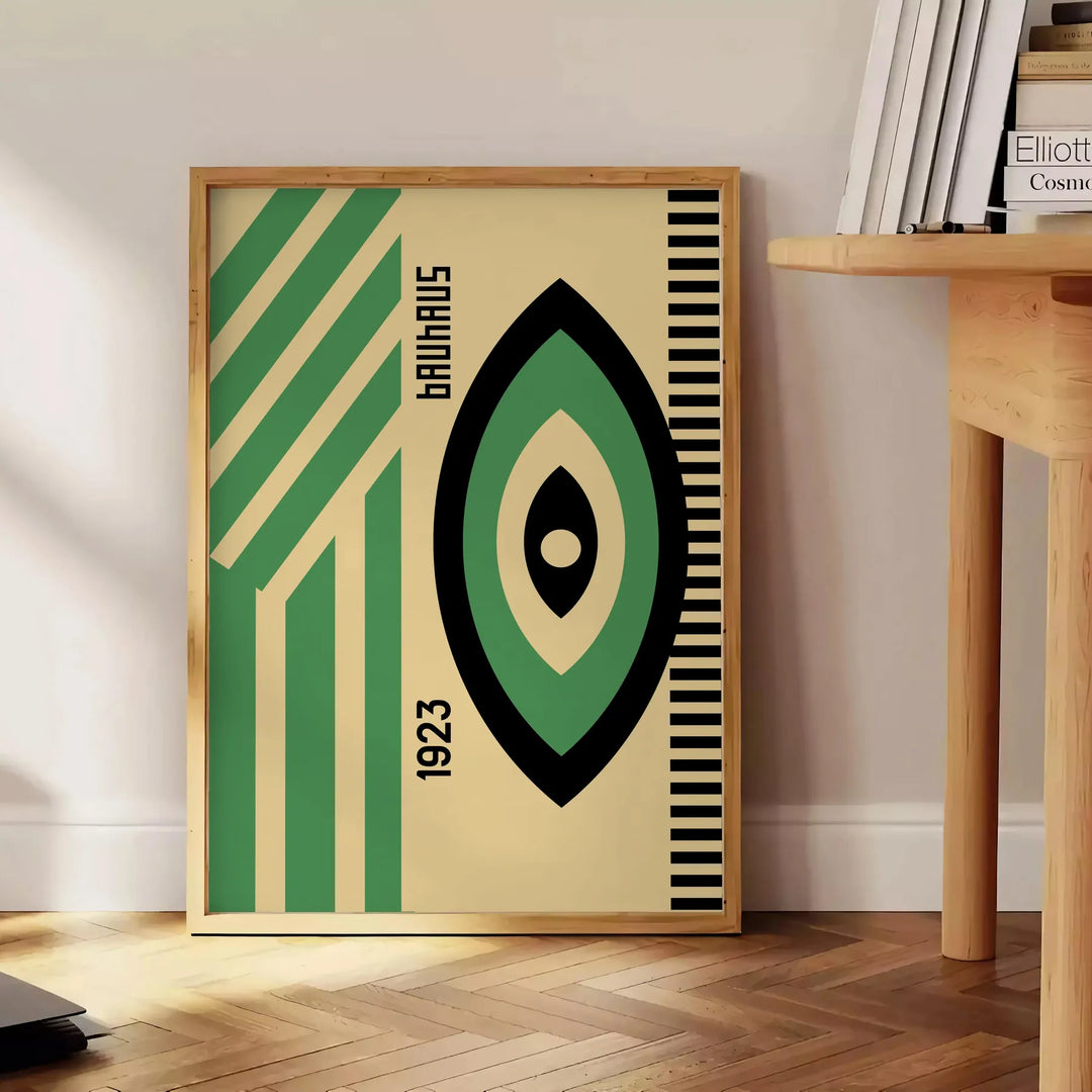 Poster showing minimalist Bauhaus geometric composition in modernist style - beside a round wooden side table with books