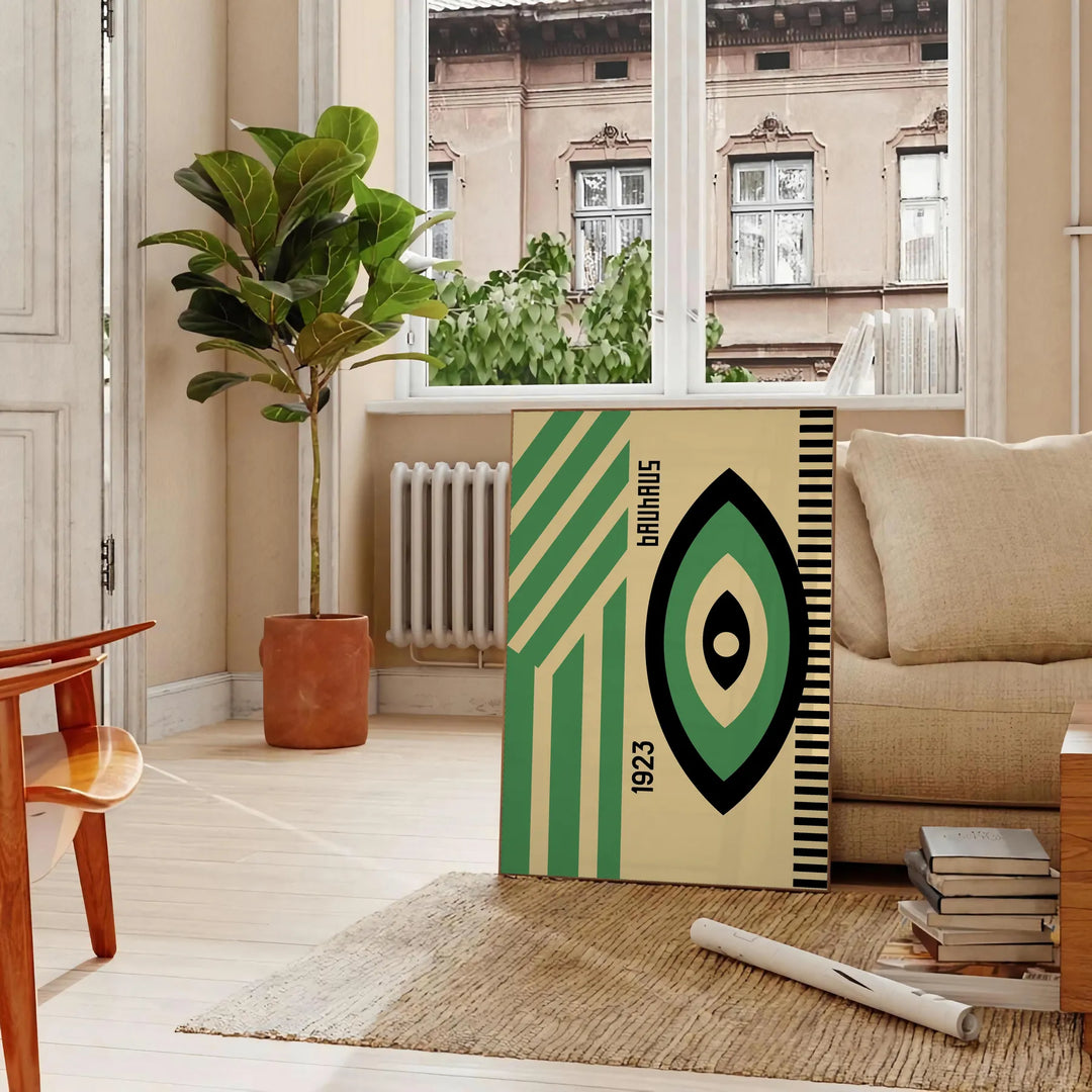 Poster showing minimalist Bauhaus geometric composition in modernist style - in a Parisian living room with a sofa and a fig plant