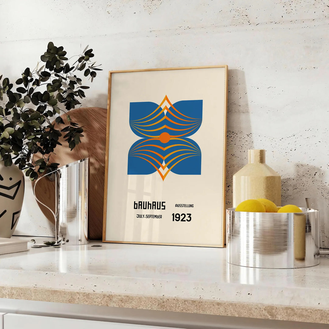 Bauhaus poster showing abstract geometric composition in minimalist modernist style - styled on a counter with eucalyptus and a bowl of lemons