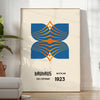 Bauhaus poster showing abstract geometric composition in minimalist modernist style - in a bright minimalist room with a plant and an armchair