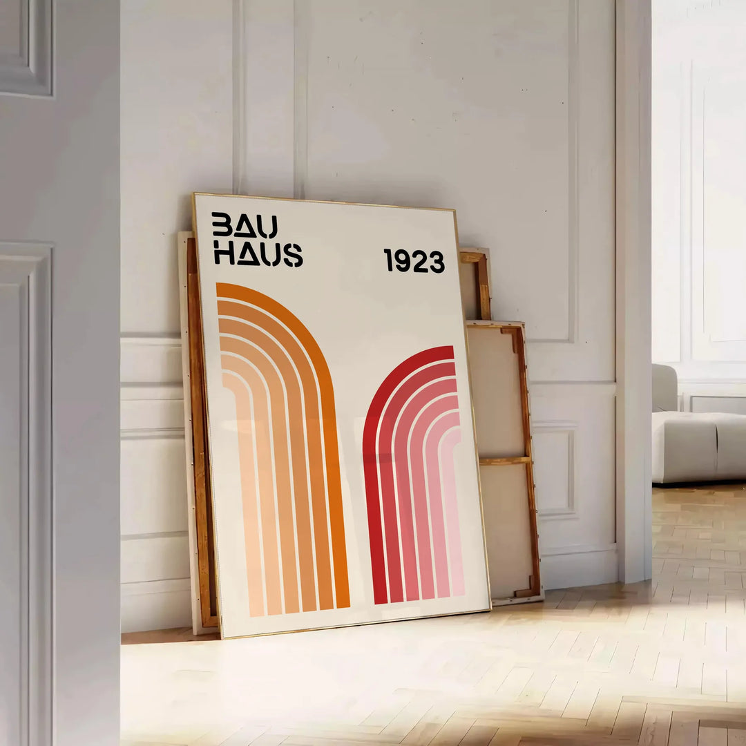 Bauhaus poster showing abstract geometric forms and minimalist composition on paper - leaning on a herringbone floor against a white panelled wall