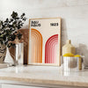 Bauhaus poster showing abstract geometric forms and minimalist composition on paper - styled on a counter with eucalyptus and a bowl of lemons