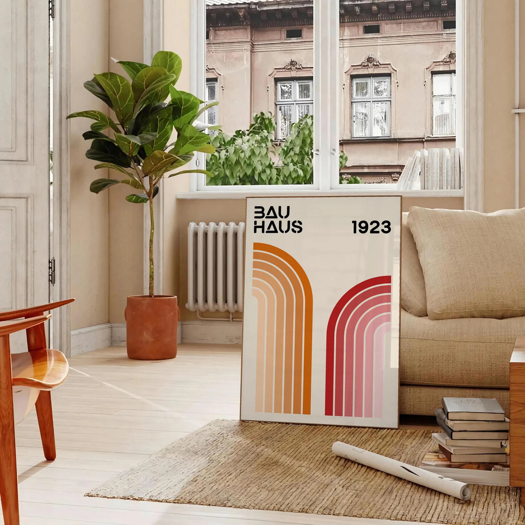 Bauhaus poster showing abstract geometric forms and minimalist composition on paper - in a Parisian living room with a sofa and a fig plant