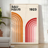 Bauhaus poster showing abstract geometric forms and minimalist composition on paper - in a bright minimalist room with a plant and an armchair