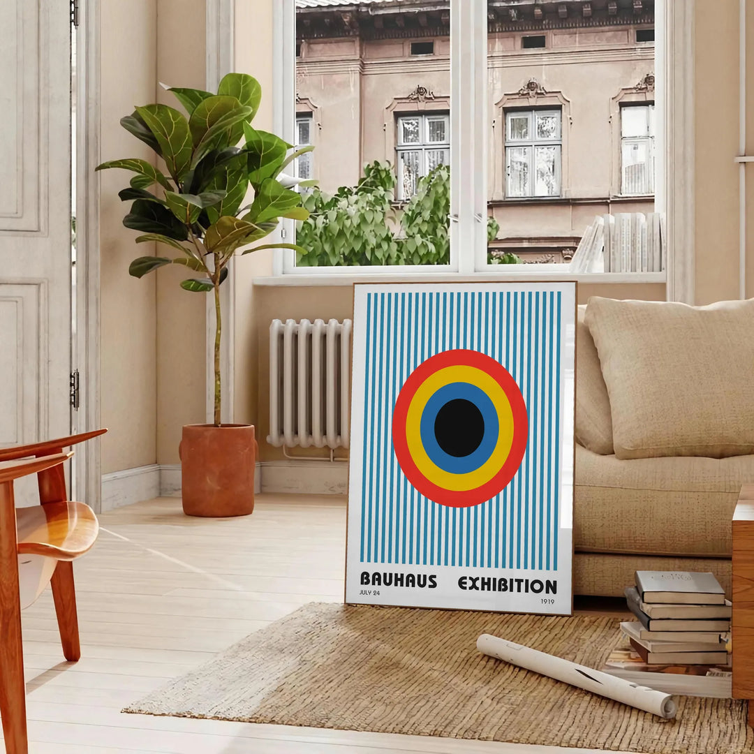 Geometric abstract shapes in gray and brown, inspired by Bauhaus style - in a Parisian living room with a sofa and a fig plant