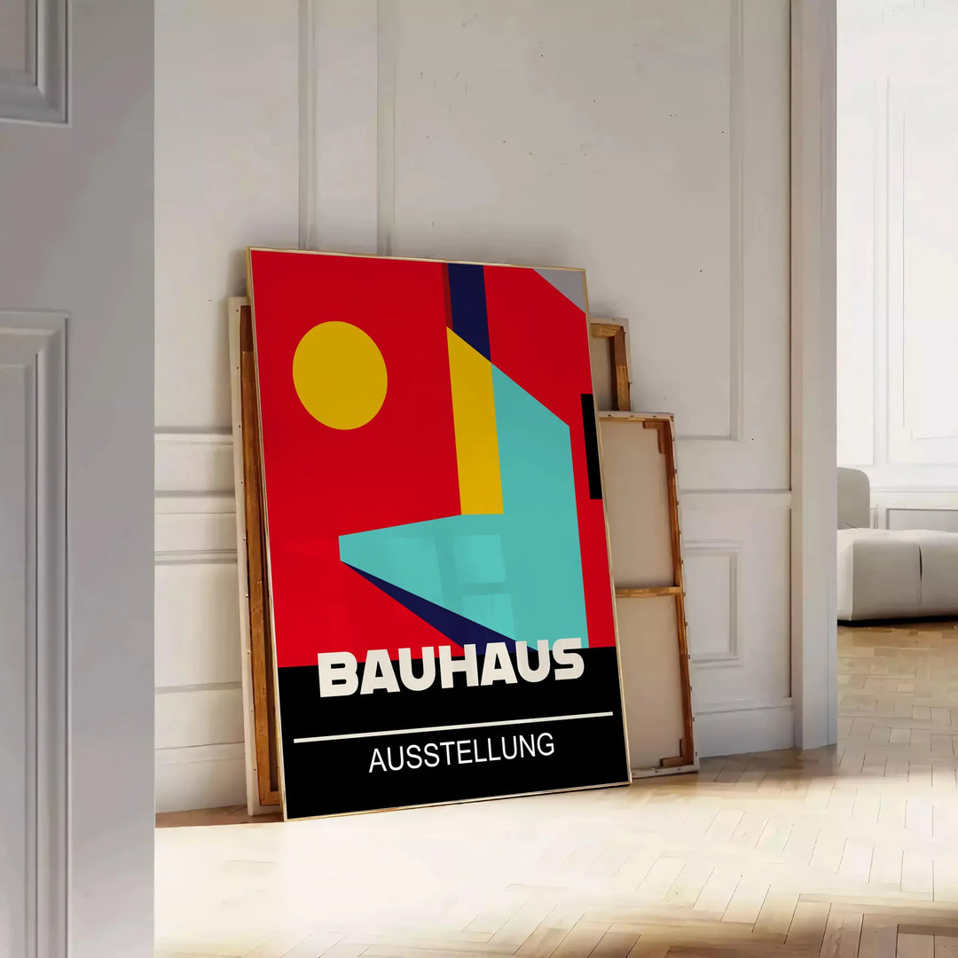 Bauhaus geometric poster in bold red and yellow abstract shapes - leaning on a herringbone floor against a white panelled wall