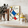 White and red geometric Bauhaus poster with bold minimalist abstract composition - styled on a counter with eucalyptus and a bowl of lemons