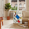 White and red geometric Bauhaus poster with bold minimalist abstract composition - in a Parisian living room with a sofa and a fig plant