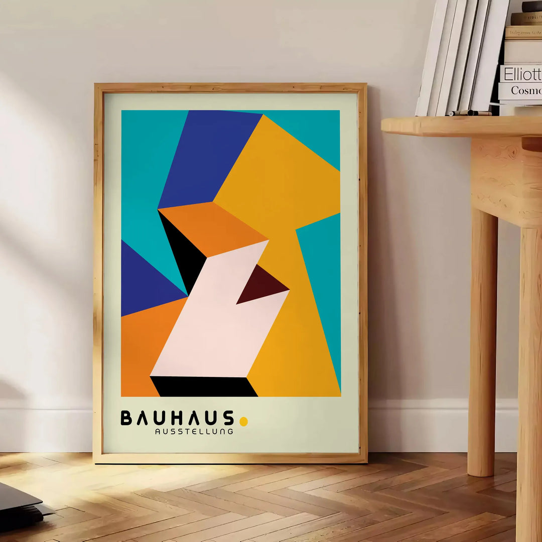 Bauhaus poster with geometric orange and green abstract shapes, modern style - beside a round wooden side table with books