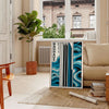 Geometric shapes and lines in Bauhaus style with primary colors - in a Parisian living room with a sofa and a fig plant