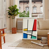 Bauhaus geometric poster with abstract shapes in red, blue, and yellow - in a Parisian living room with a sofa and a fig plant
