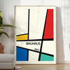 Bauhaus geometric poster with abstract shapes in red, blue, and yellow - in a bright minimalist room with a plant and an armchair
