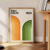 Minimal Bauhaus poster with abstract geometric composition and modernist design - beside a round wooden side table with books