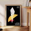 Abstract Bauhaus design featuring groovy shapes in orange and black - beside a round wooden side table with books