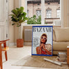 Abstract artwork featuring a dynamic blend of orange and blue colors - in a Parisian living room with a sofa and a fig plant