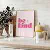 Colorful abstract design featuring the phrase 'Be Kind' in playful typography - styled on a counter with eucalyptus and a bowl of lemons