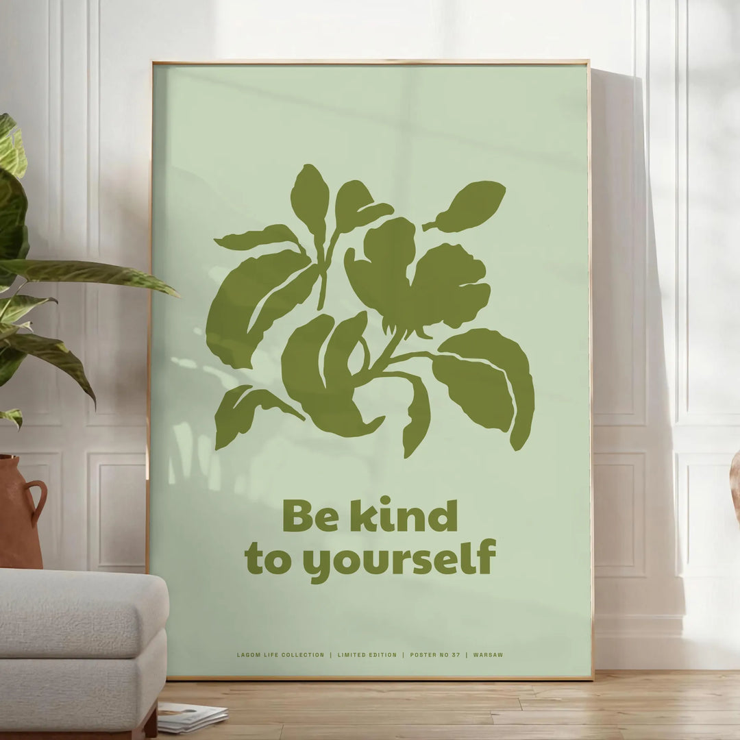 A serene yoga scene featuring calming green and gray tones with the phrase 'Be Kind To Yourself' - in a bright minimalist room with a plant and an armchair