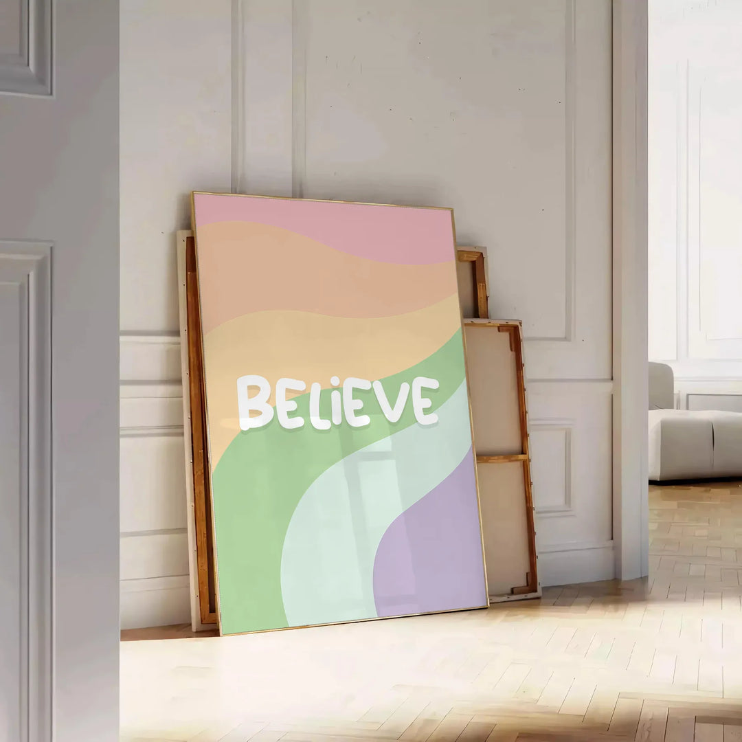 Abstract design with the word 'Believe' in green and orange hues - leaning on a herringbone floor against a white panelled wall