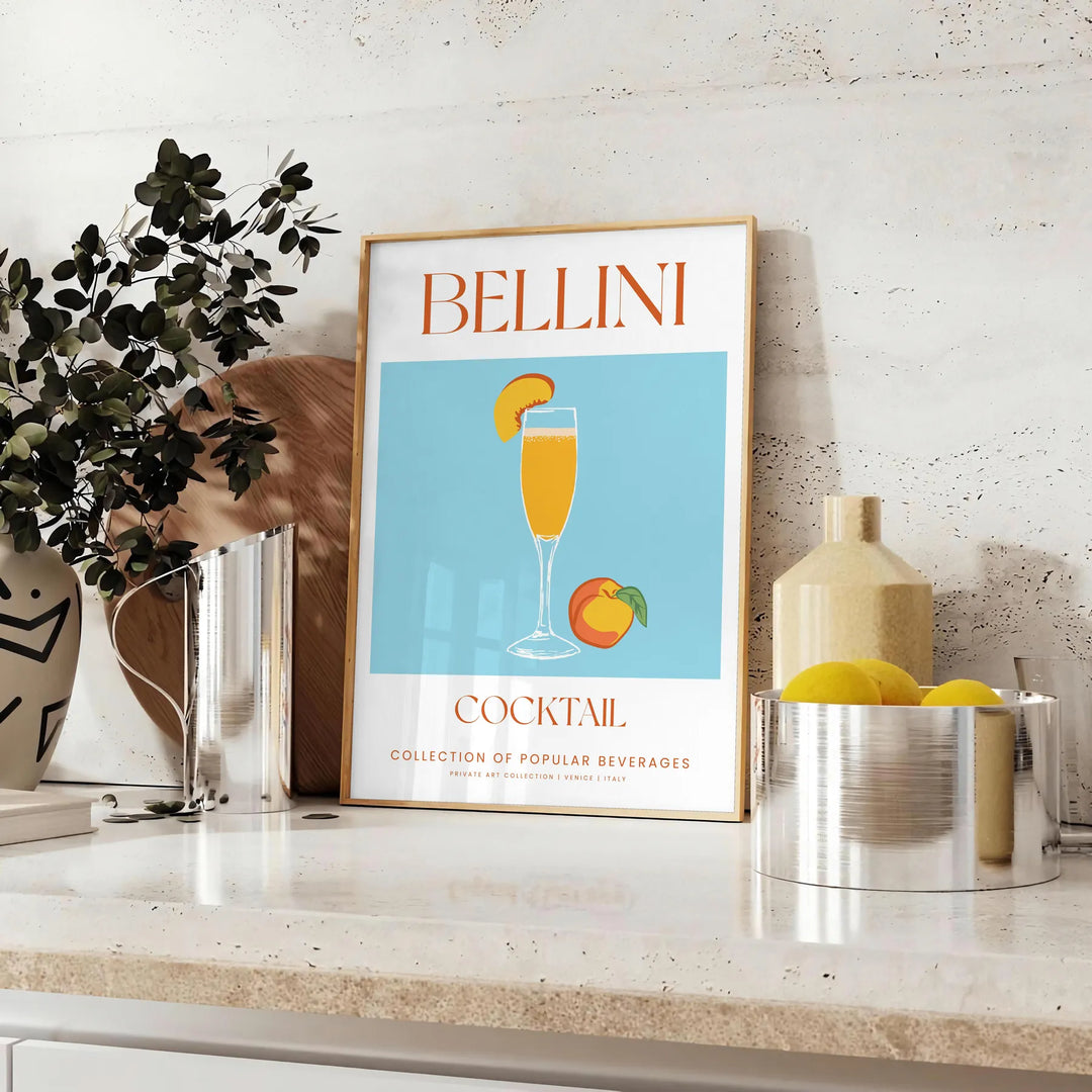 Illustration of a Bellini cocktail with green and orange colors - styled on a counter with eucalyptus and a bowl of lemons