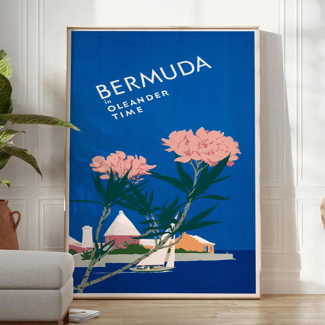 Bermuda travel poster featuring a serene beach scene with blue and green hues - in a bright minimalist room with a plant and an armchair