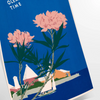 Bermuda travel poster featuring a serene beach scene with blue and green hues - as a rolled, unframed print