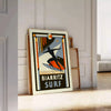 Orange and black Biarritz surf poster in minimalist retro graphic style - leaning on a herringbone floor against a white panelled wall