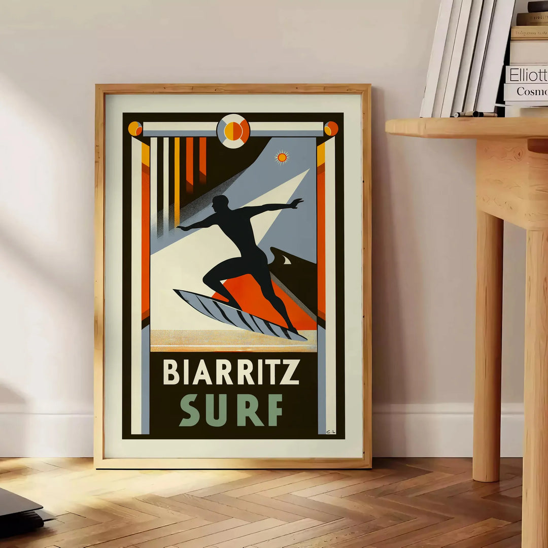 Orange and black Biarritz surf poster in retro graphic style - beside a round wooden side table with books