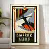 Orange and black Biarritz surf poster in retro graphic style - in a bright minimalist room with a plant and an armchair