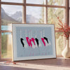 A stylized bird illustration in black and blue tones - beside a round wooden side table with books