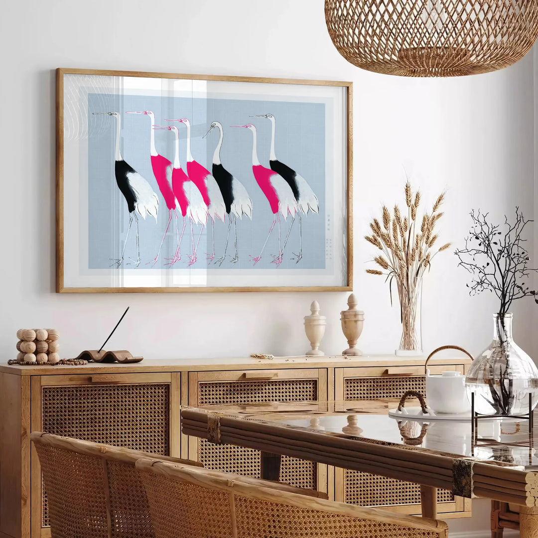 A stylized bird illustration in black and blue tones - in a Parisian living room with a sofa and a fig plant