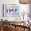 A stylized bird illustration in black and blue tones - in a Parisian living room with a sofa and a fig plant