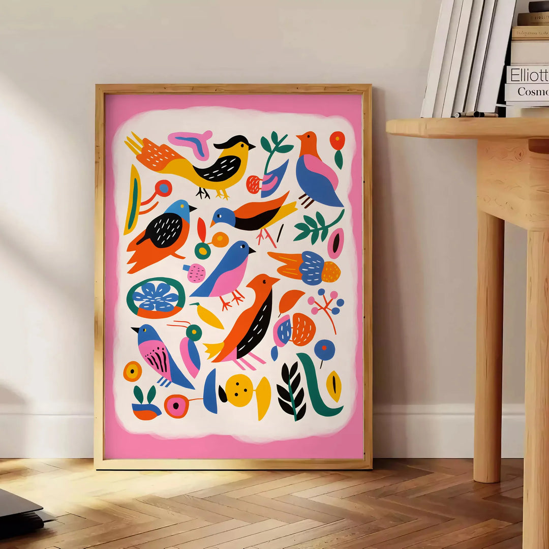 A colorful bird illustration with bold orange and blue hues - beside a round wooden side table with books