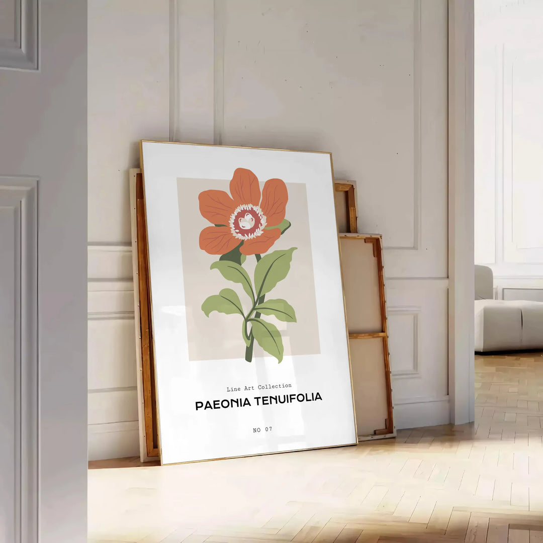 A close-up of colorful blossoms in shades of green and orange - leaning on a herringbone floor against a white panelled wall