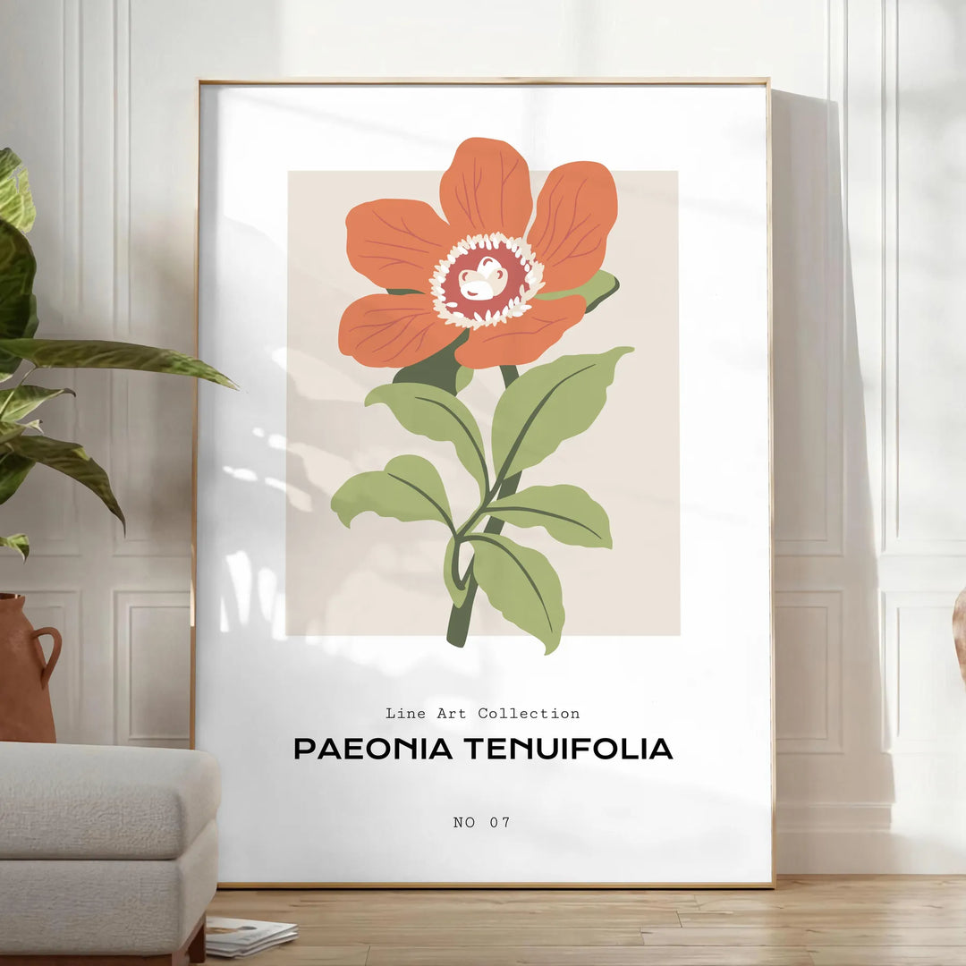 A close-up of colorful blossoms in shades of green and orange - in a bright minimalist room with a plant and an armchair
