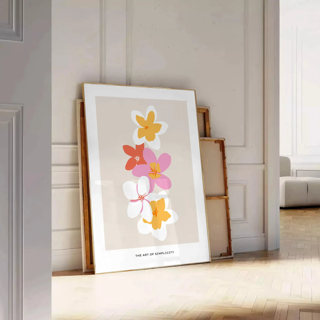 abstract flower design with black and orange hues - leaning on a herringbone floor against a white panelled wall