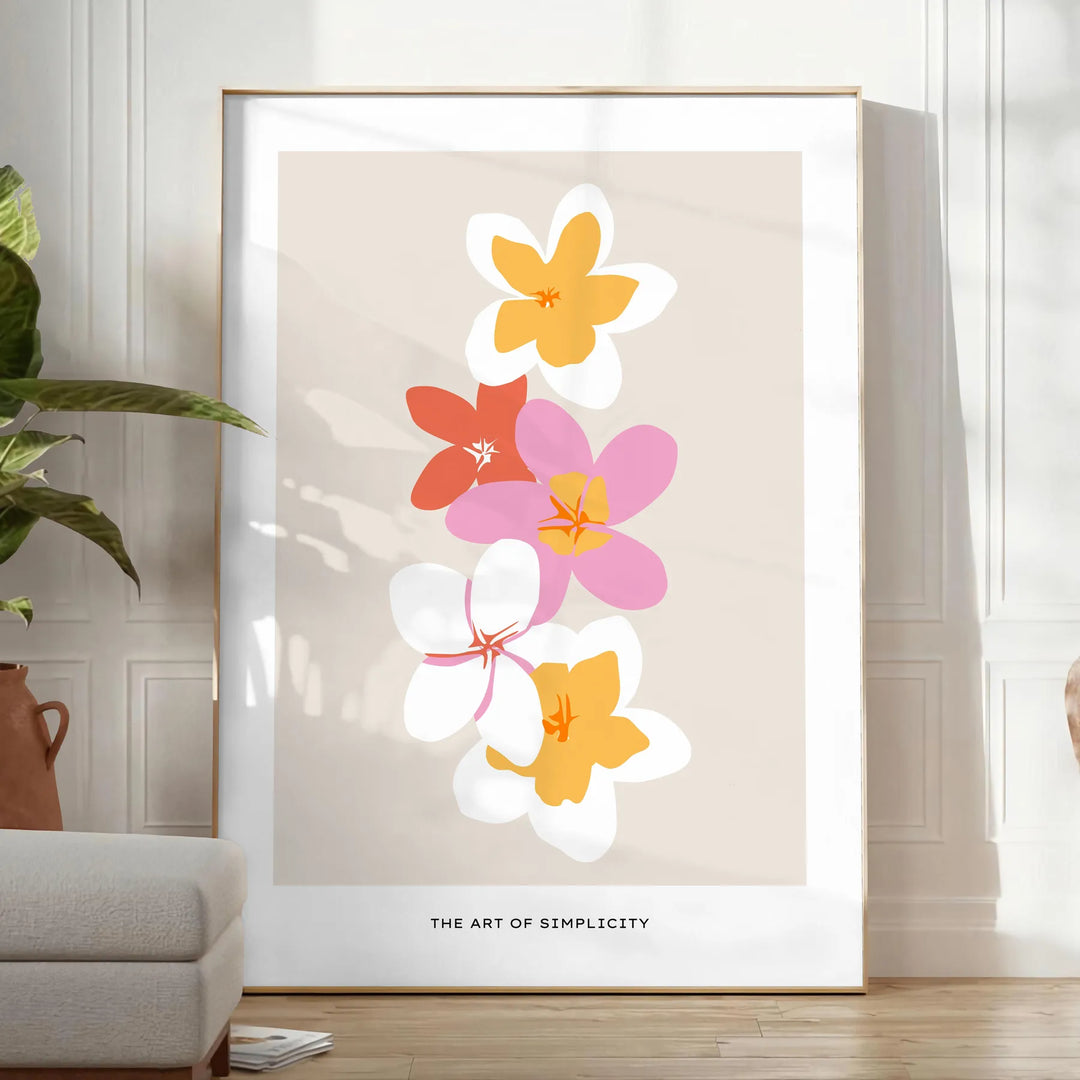 abstract flower design with black and orange hues - in a bright minimalist room with a plant and an armchair