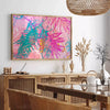 Vintage floral poster featuring orange and blue blossoms against a textured background - in a Parisian living room with a sofa and a fig plant