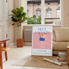 A colorful illustration of a Blue Lagoon cocktail with tropical elements - in a Parisian living room with a sofa and a fig plant